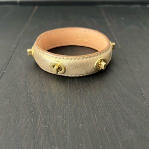 Coach gold leather turn lock bangle bracelet